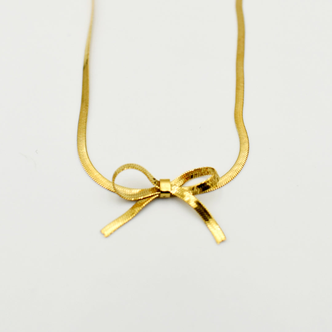 Gold Toned Knot Snake Bow Necklace