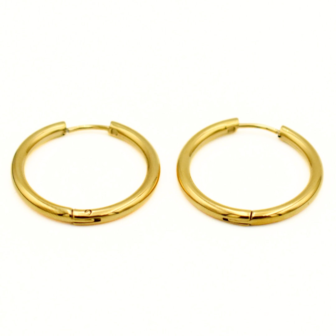 Gold Toned Medium Smooth Huggies