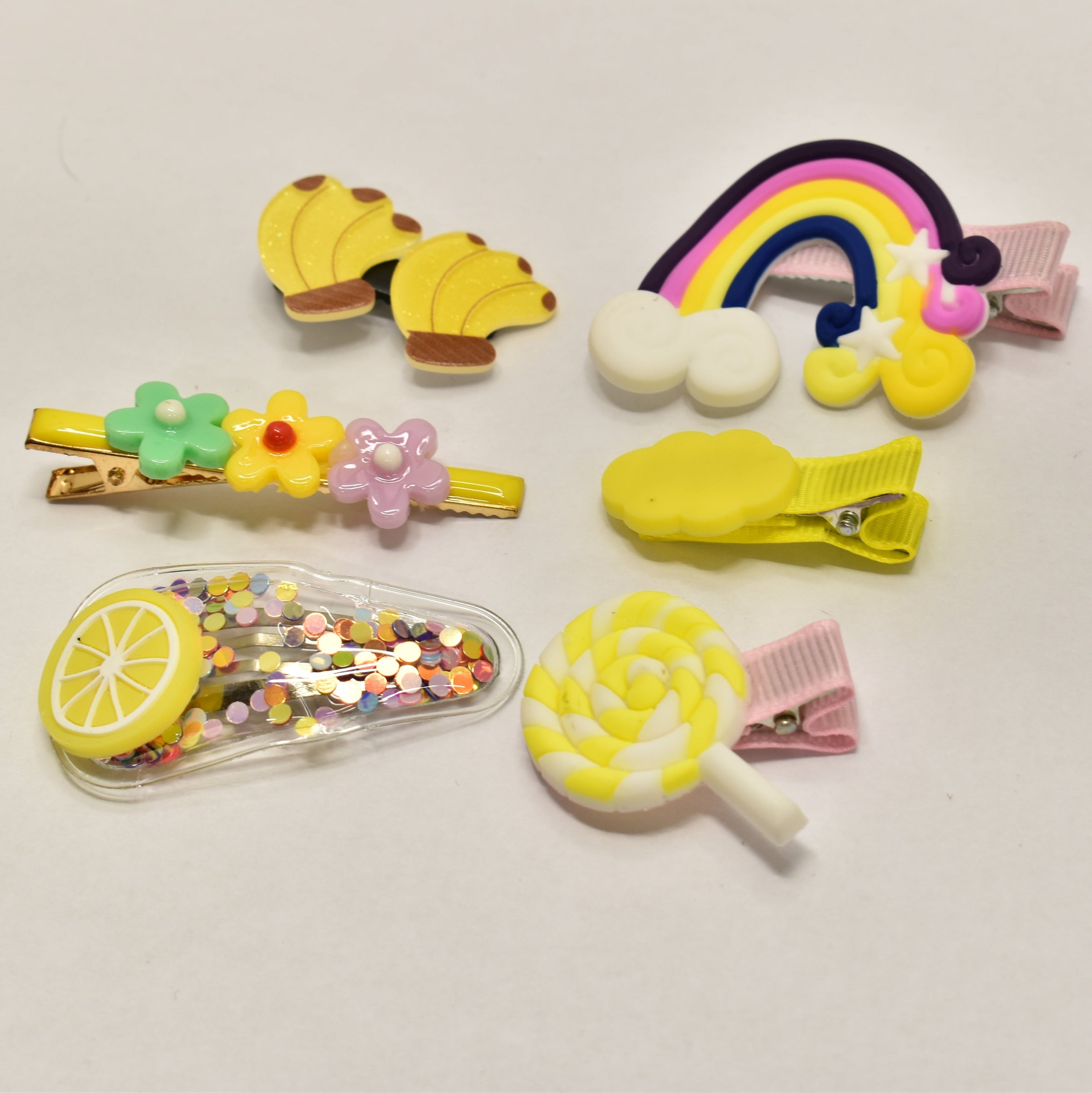 Colourful butterfly and flower kids hair clip set with snap closure in assorted rainbow shades by Elli Jewellery