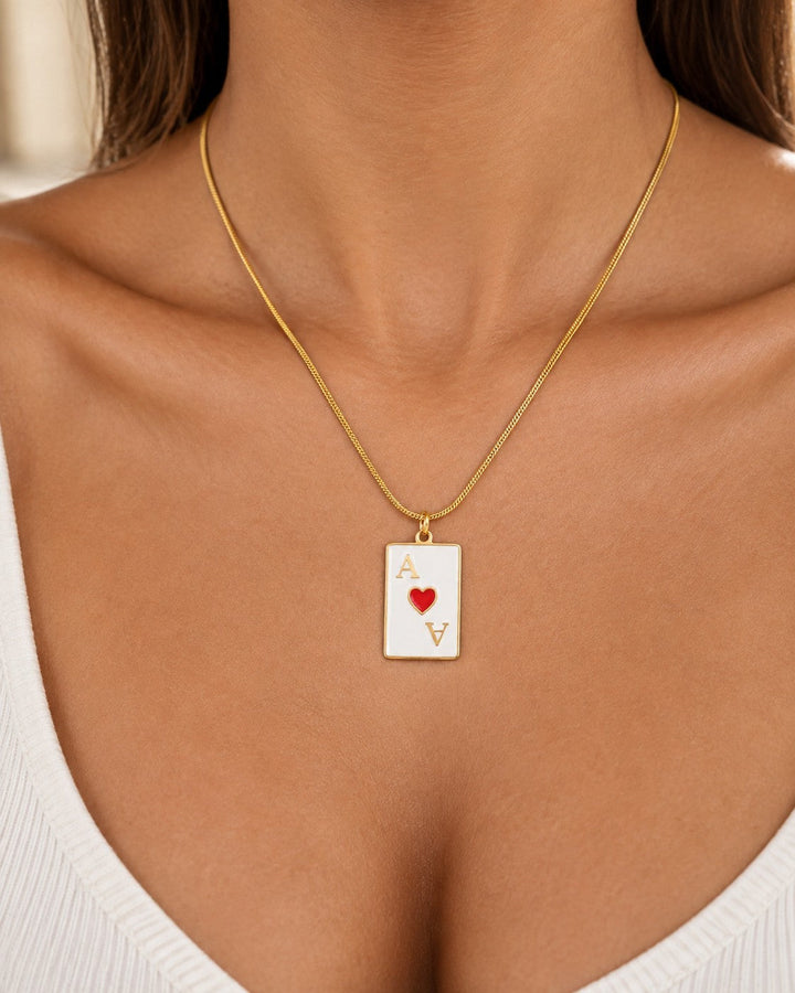 Elli Jewellery gold plated Ace of Hearts playing card pendant necklace worn on a delicate gold chain