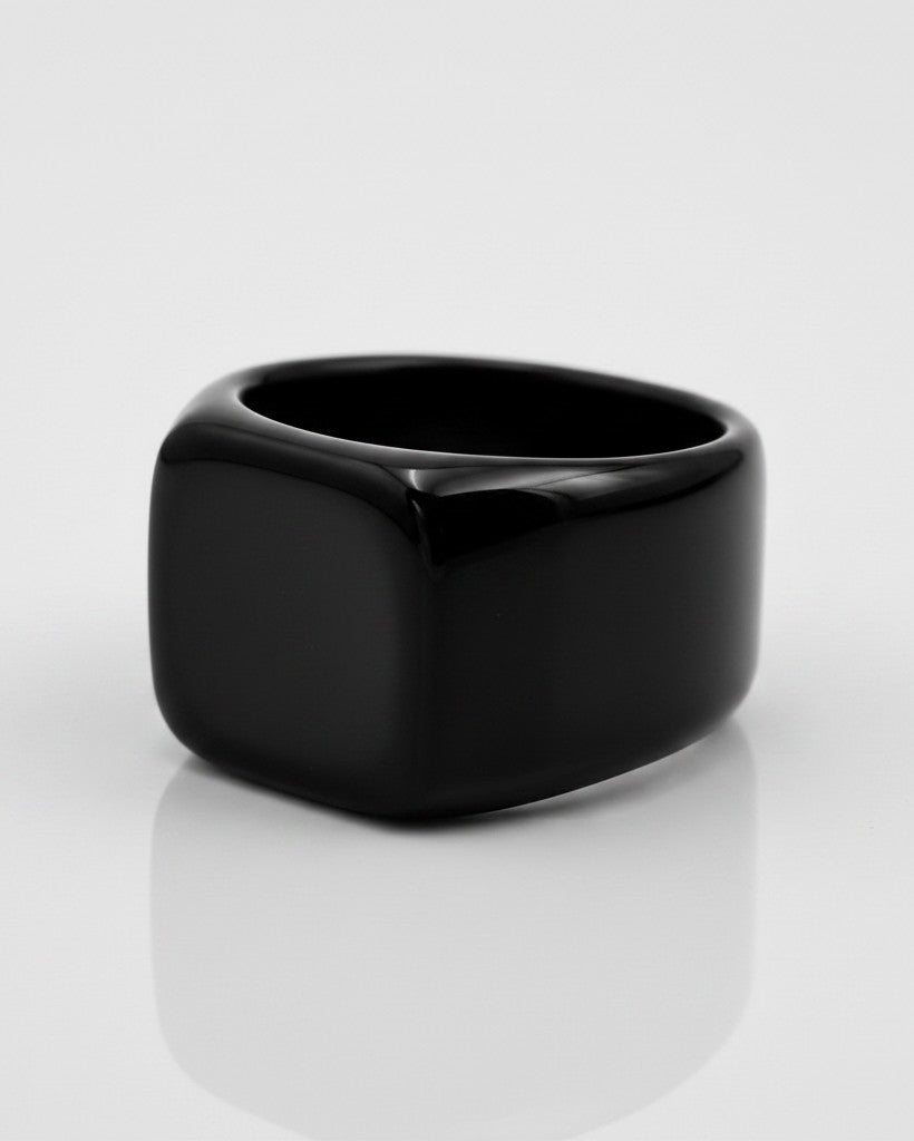 Elli Jewellery gold plated signet ring featuring a smooth, minimalist black enamel face on a white background.