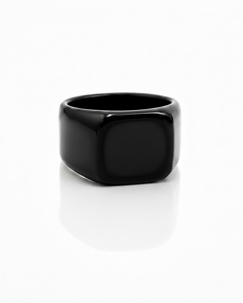 Elli Jewellery gold plated signet ring featuring a smooth, minimalist black enamel face on a white background.