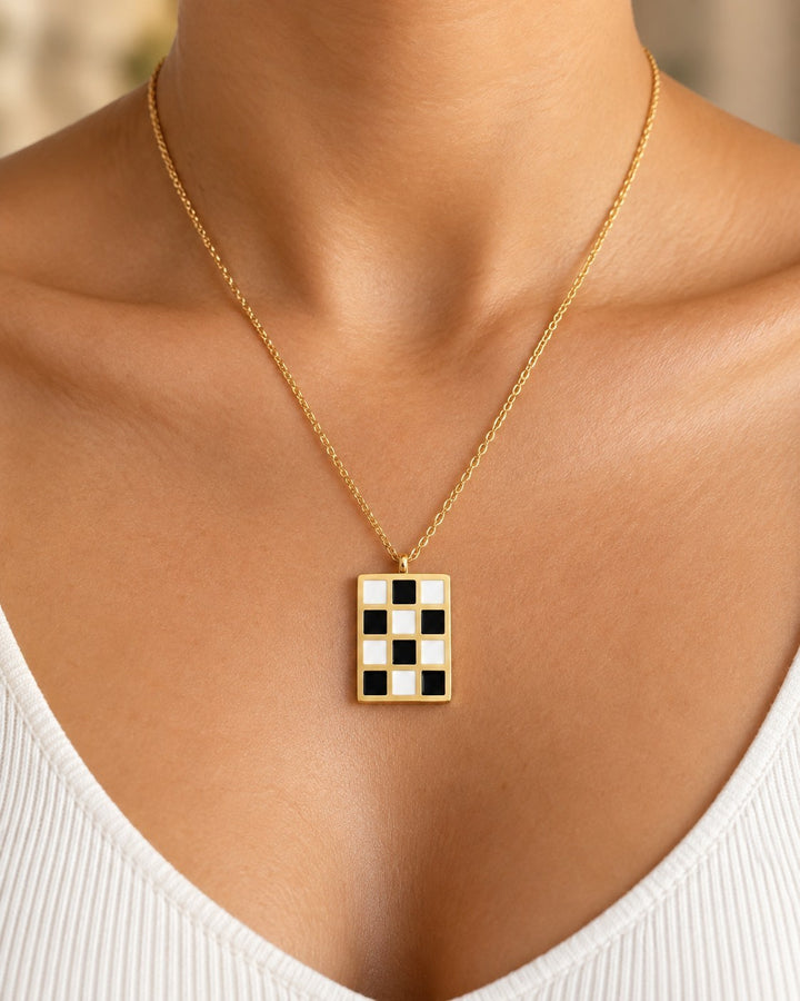 Elli Jewellery gold plated rectangular pendant necklace featuring a black and white checkered pattern on a fine chain