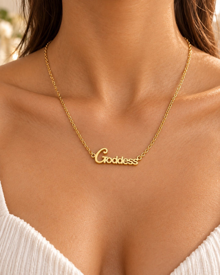 Elli Jewellery gold plated Goddess pendant necklace worn on a delicate chain against a woman's neck