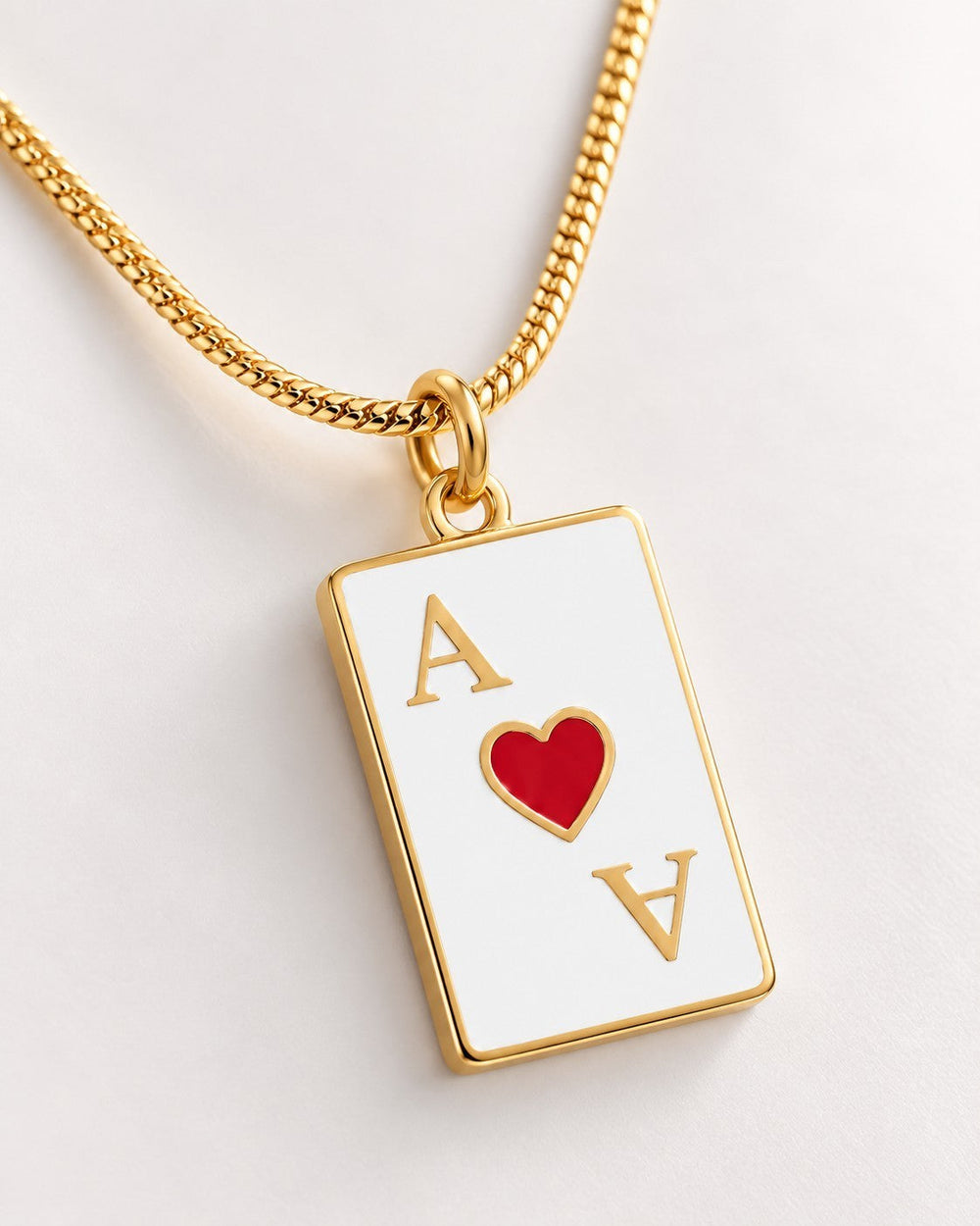 Elli Jewellery gold plated Ace of Hearts playing card pendant necklace on a delicate gold chain