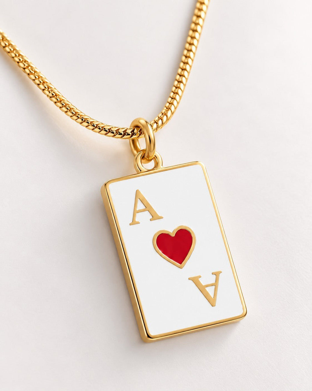 Elli Jewellery gold plated Ace of Hearts playing card pendant necklace on a delicate gold chain