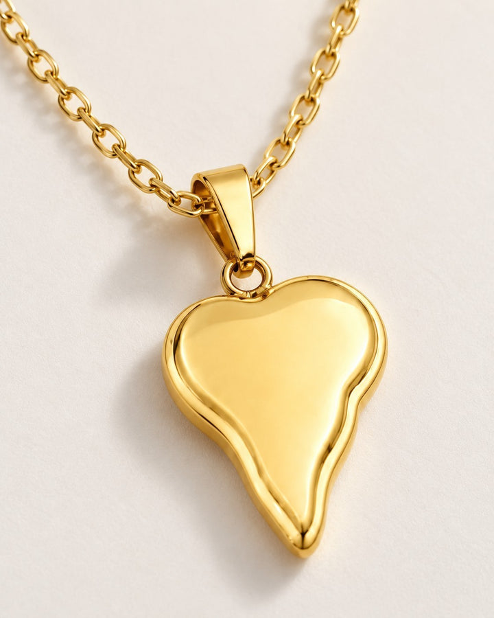 Elli Jewellery gold plated waterproof necklace featuring a modern asymmetric heart pendant on a delicate chain.