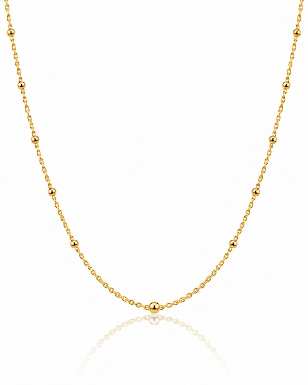 Elli Jewellery gold plated dainty ball bead chain necklace with a delicate minimalist design on a white background.