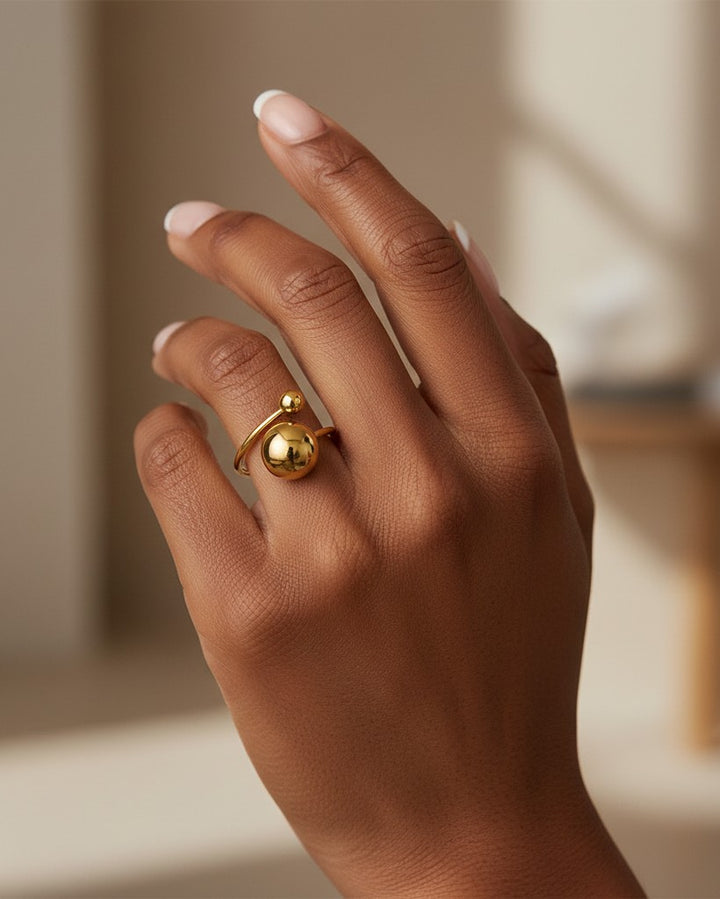 Elli Jewellery gold plated waterproof open ball bead statement ring worn on a finger
