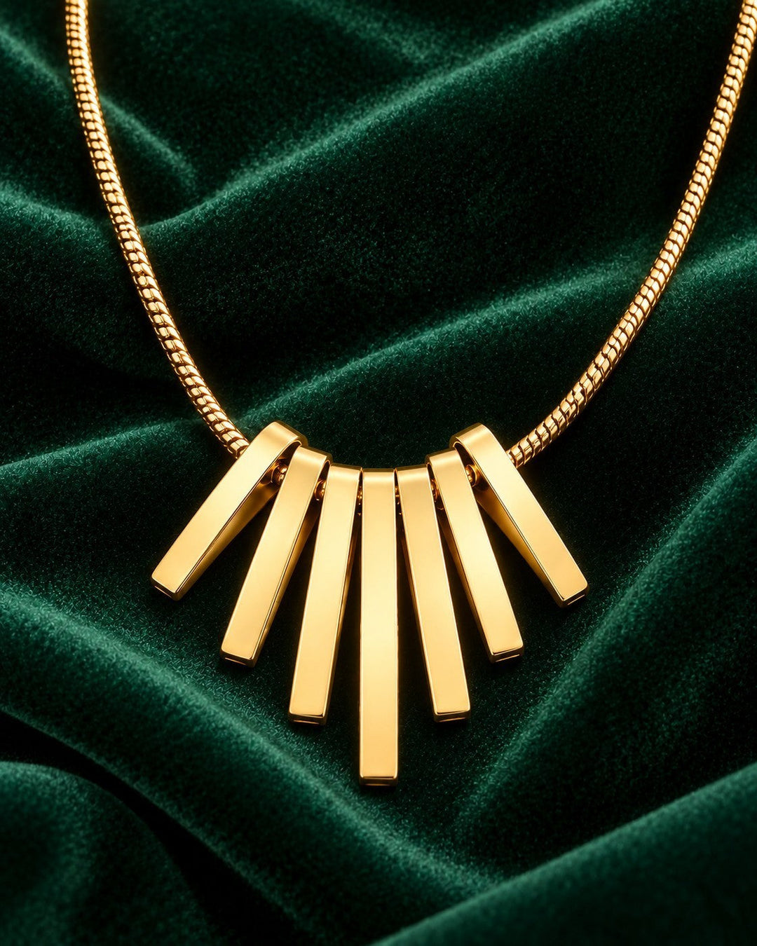 Elli Jewellery gold plated necklace featuring a fan-shaped pendant with five sleek vertical bars on a chain.