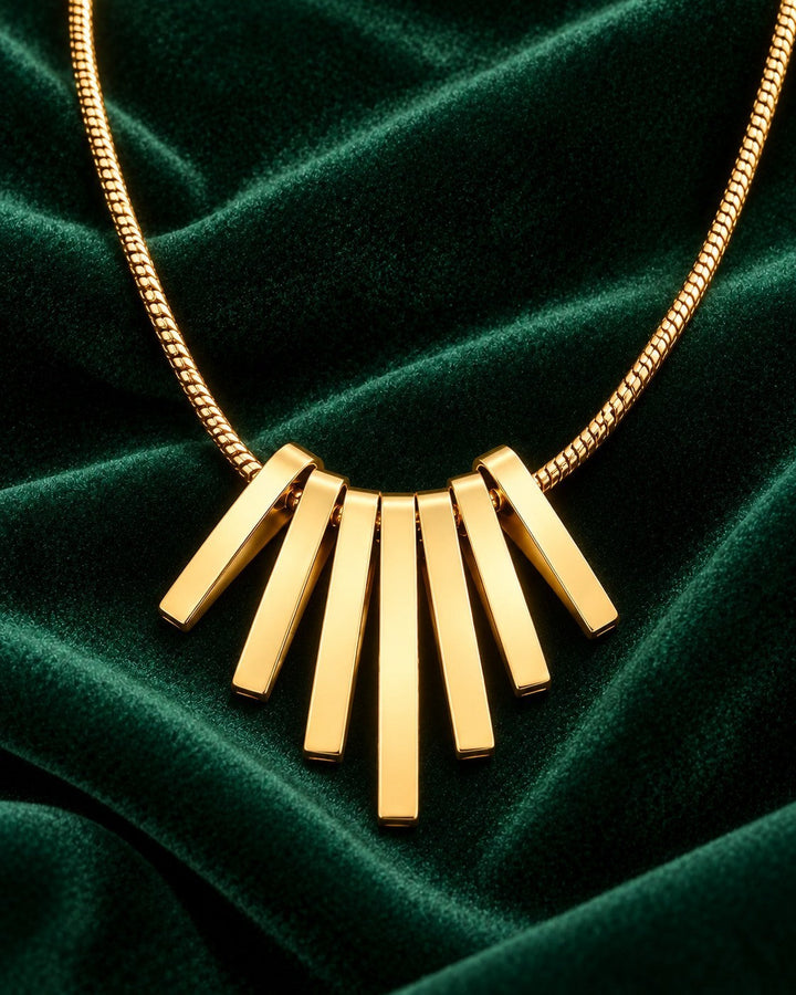 Elli Jewellery gold plated necklace featuring a fan-shaped pendant with five sleek vertical bars on a chain.