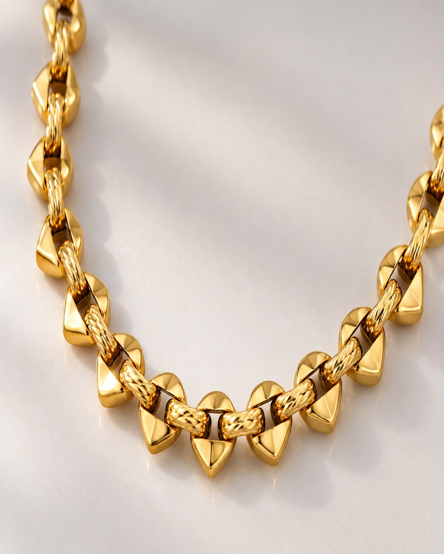 Elli Jewellery 18ct gold plated brass spherical beaded chain necklace with textured links on a white background