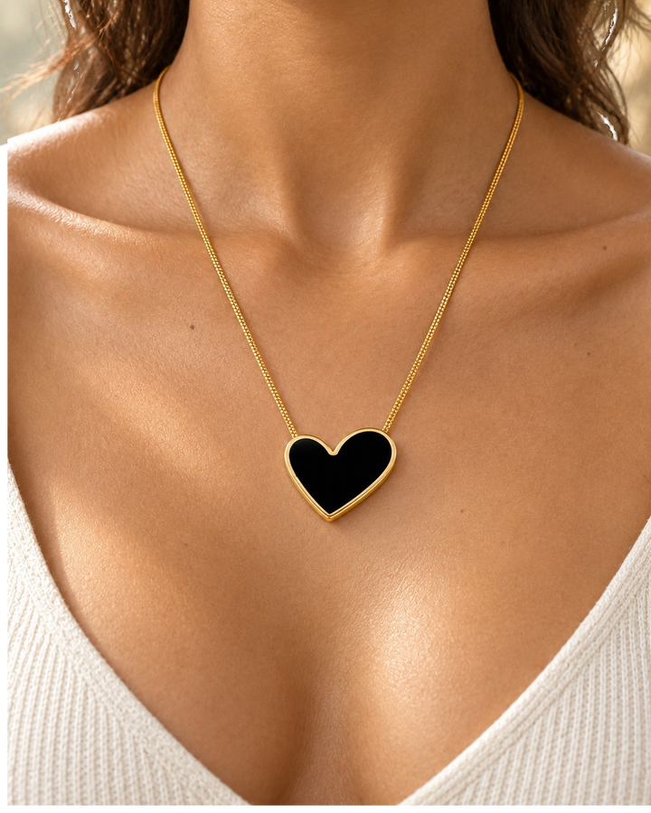 Elli Jewellery gold plated necklace featuring a glossy black enamel heart pendant on a delicate gold chain