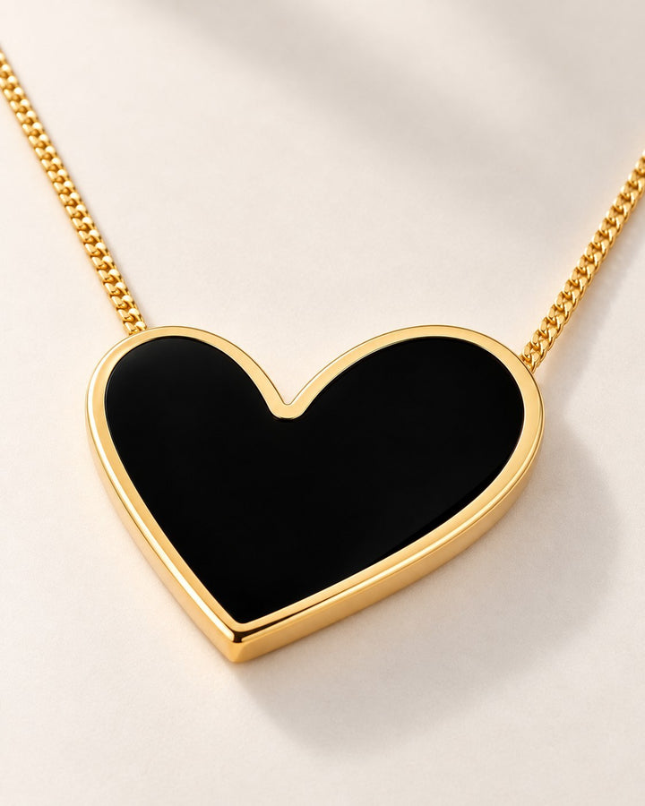 Elli Jewellery gold plated necklace featuring a glossy black enamel heart pendant on a delicate gold chain