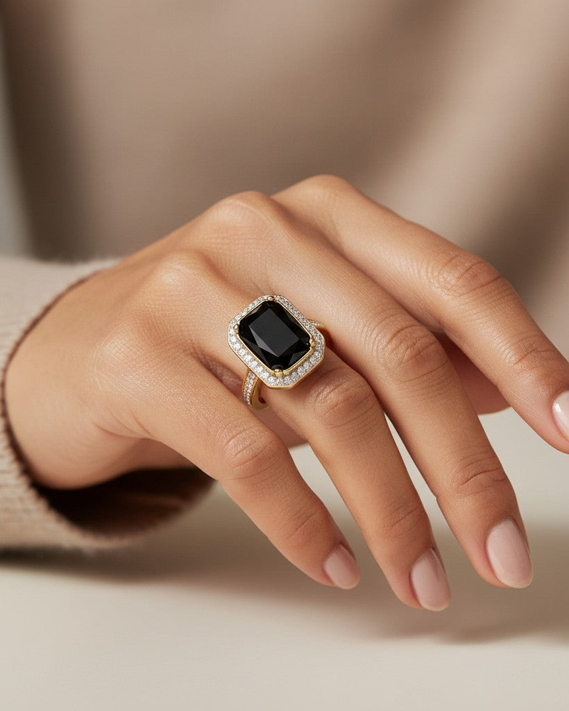 Elli Jewellery gold plated chunky ring featuring a large rectangular black stone surrounded by a halo of crystals.