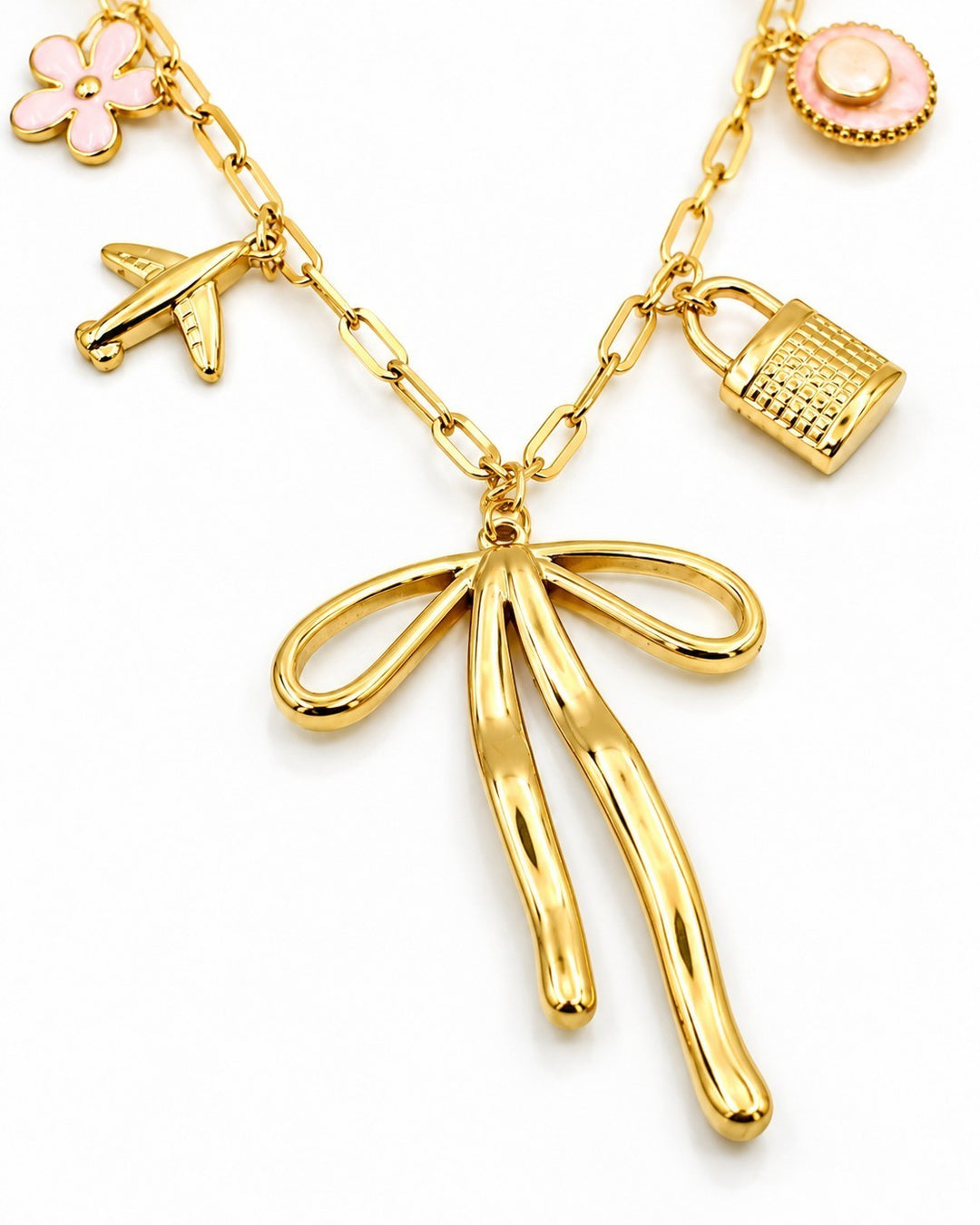 Elli Jewellery gold plated charm necklace featuring a ribbon bow, airplane, padlock, and pink flower charms.