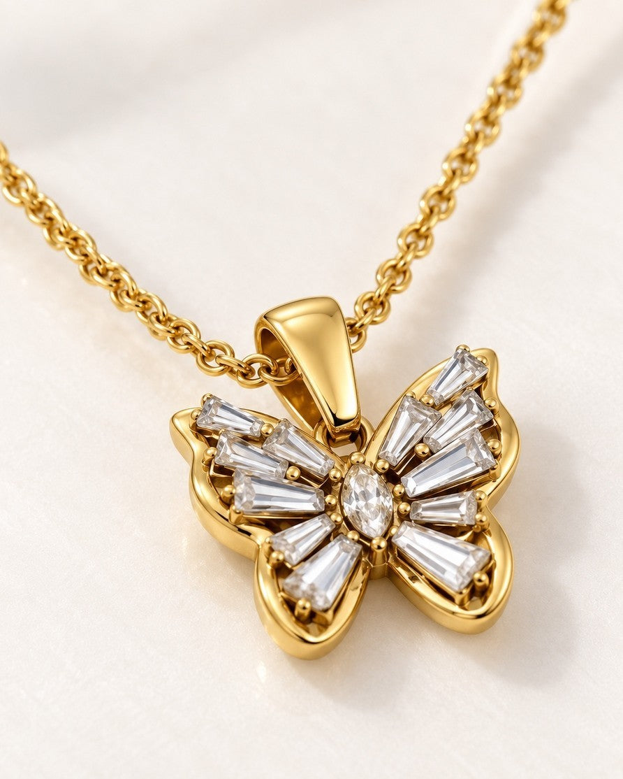 Elli Jewellery gold plated butterfly pendant necklace featuring sparkling baguette and marquise cut cubic zirconia