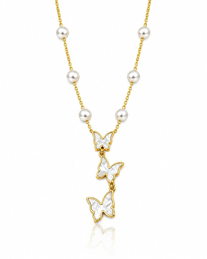 Elli Jewellery gold plated necklace featuring three white butterfly pendants and delicate pearl accents on a chain.
