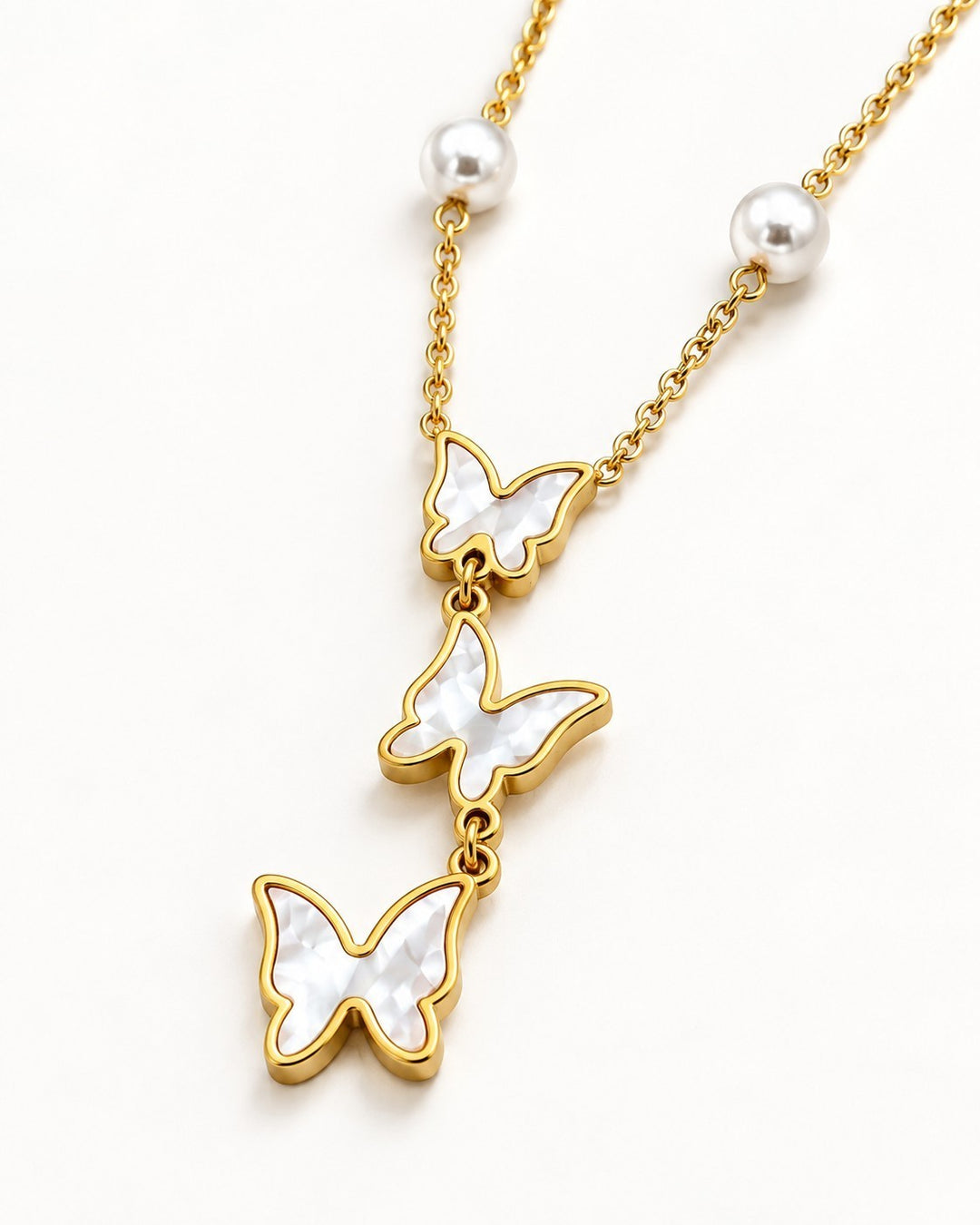 Elli Jewellery gold plated necklace featuring three butterfly pendants with mother of pearl inlay and pearl accents
