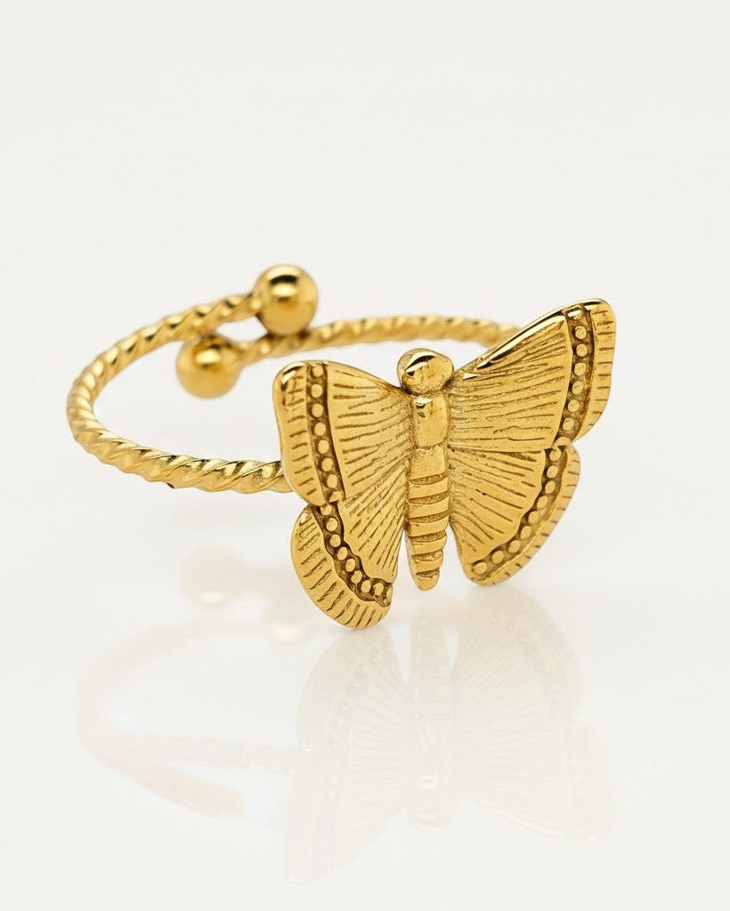 Elli Jewellery gold plated adjustable ring featuring a delicate open butterfly design with a twisted band.