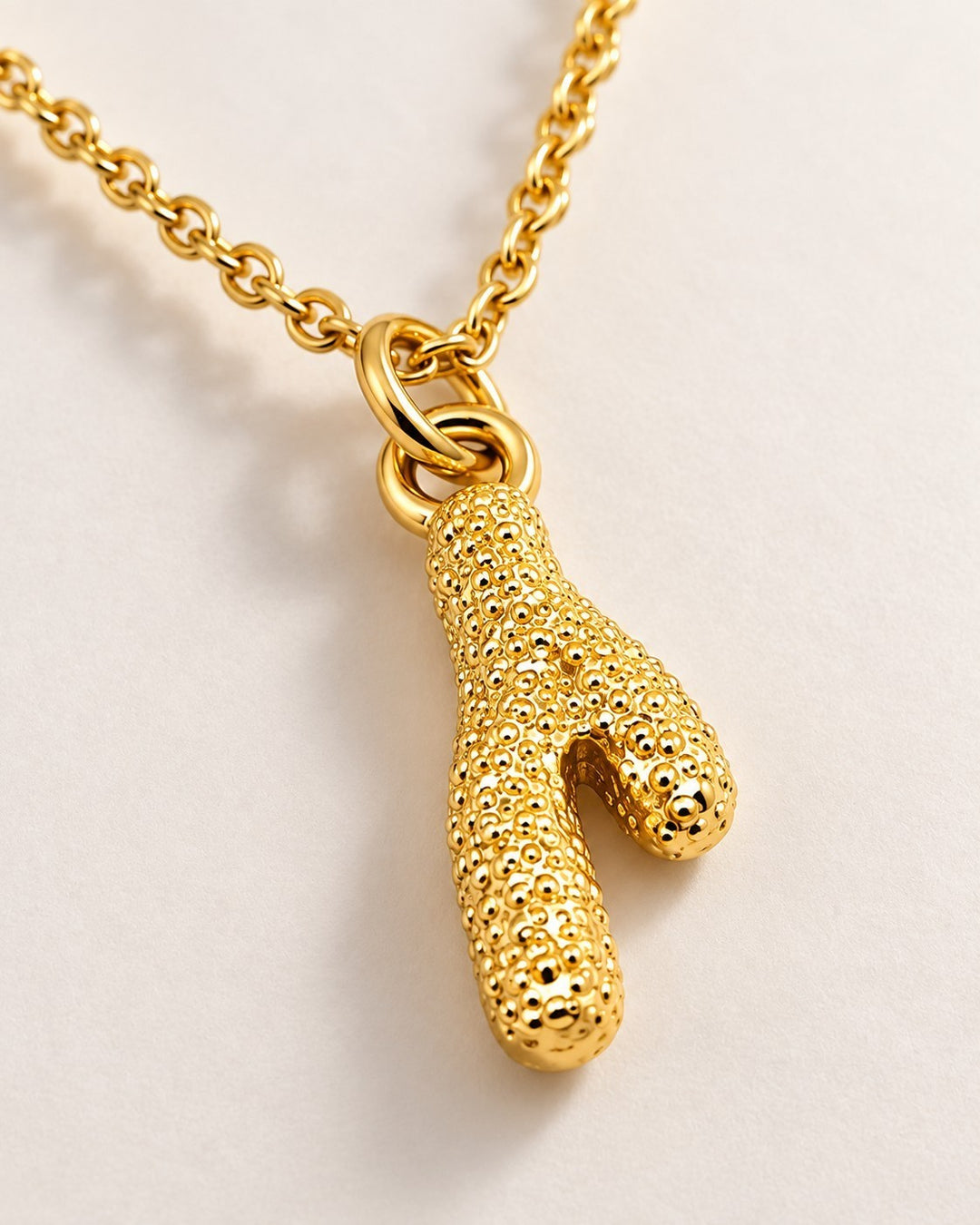 Elli Jewellery gold plated stainless steel cactus pendant on a dainty chain, waterproof and tarnish-free design.