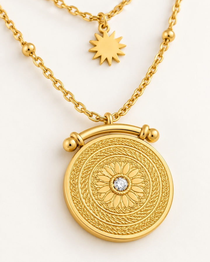 Elli Jewellery gold plated double layered necklace featuring a celestial sun charm and an intricate sundial pendant.