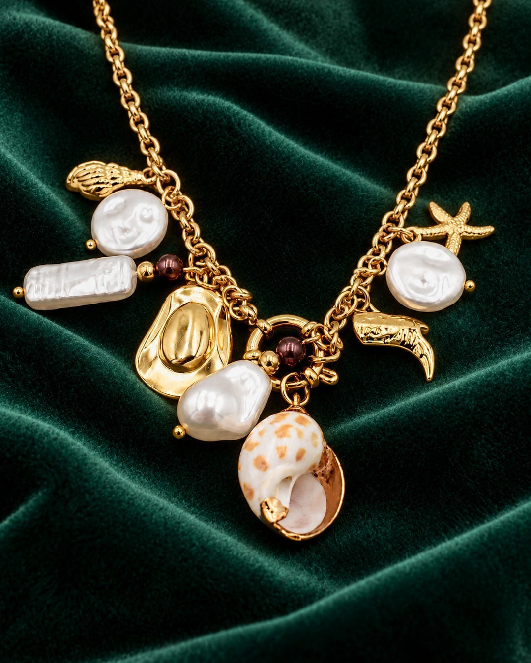Elli Jewellery gold plated multi-charm necklace featuring baroque pearls, seashells, and cowboy boot charms.