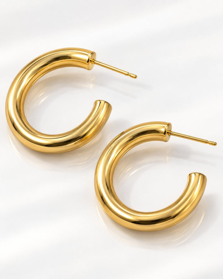 Elli Jewellery gold plated chunky hoop earrings with a polished finish, waterproof and hypoallergenic design.