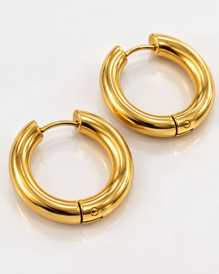 Elli Jewellery 3cm gold plated chunky hoop earrings with a polished textured surface finish.