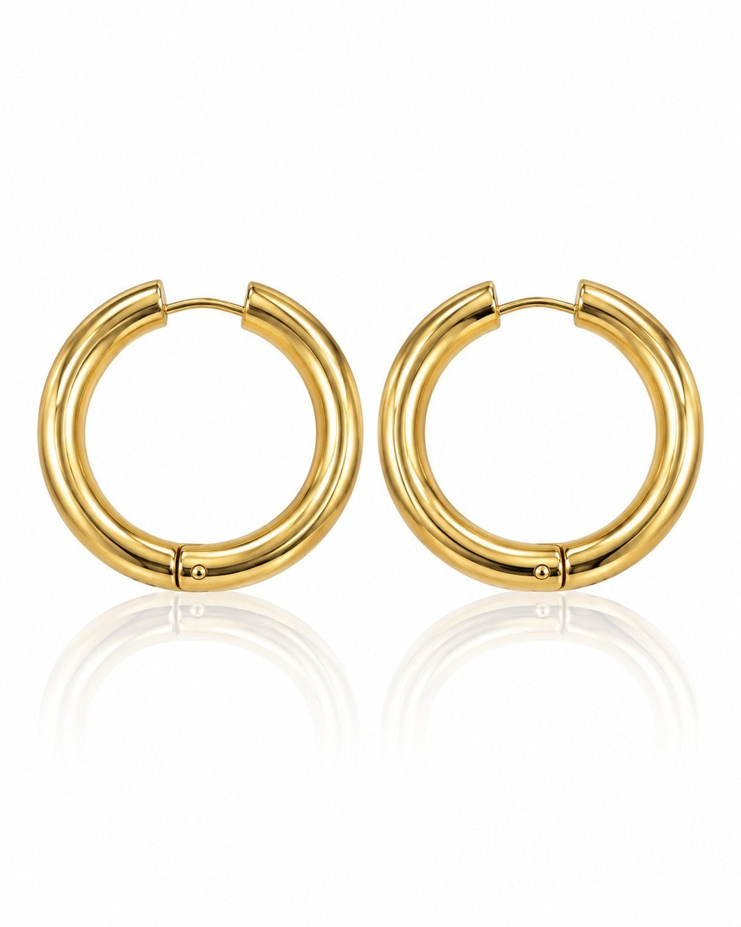 Elli Jewellery gold plated chunky huggie hoop earrings with a polished finish on a white background.