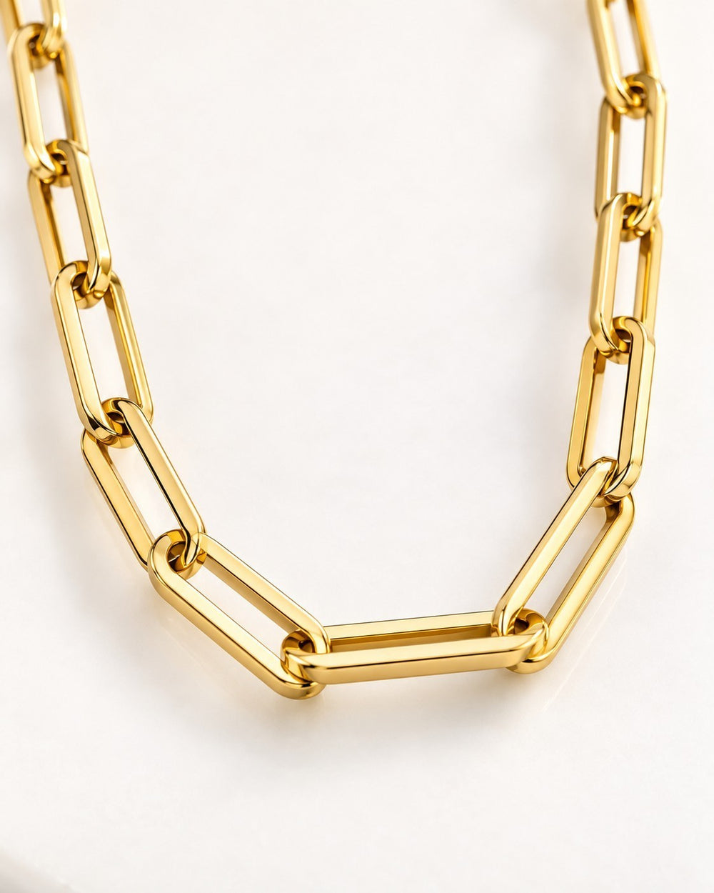 Elli Jewellery gold plated chunky paper link chain necklace with a polished finish on a white background