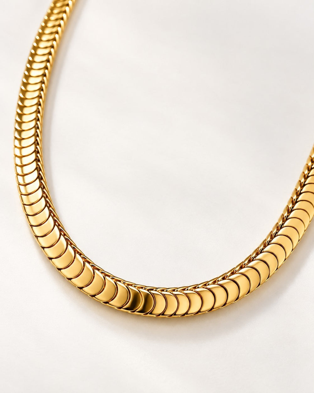 Elli Jewellery gold plated chunky snake chain necklace with a smooth, polished finish on a white background.