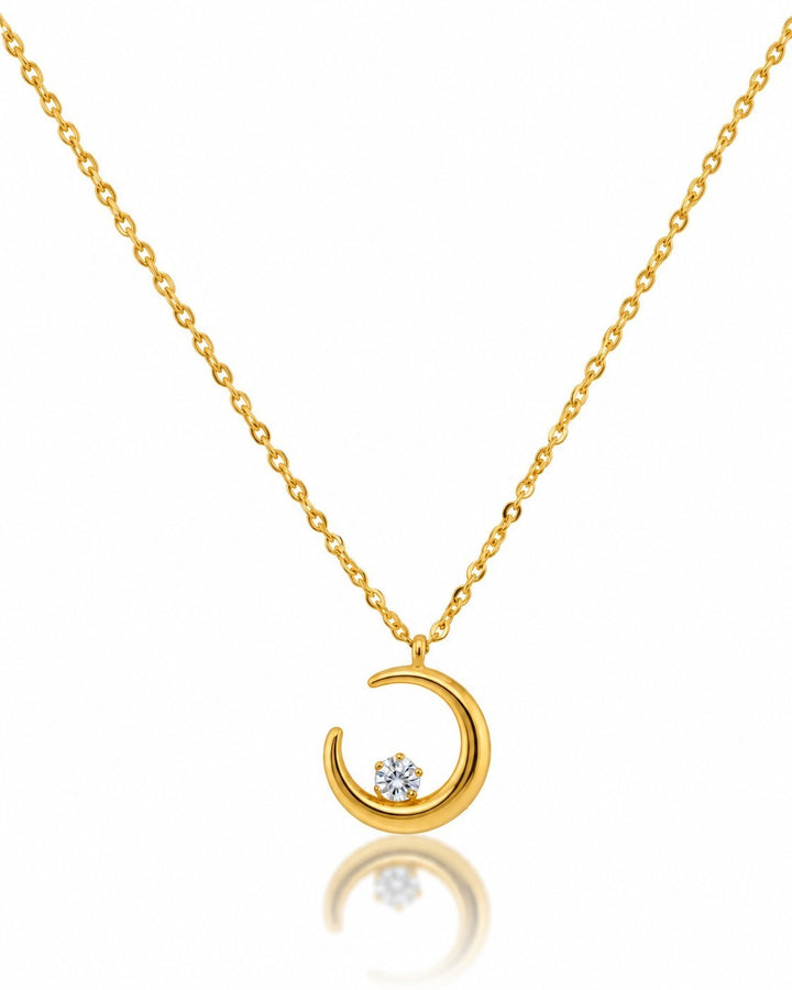 Elli Jewellery gold plated crescent moon pendant necklace with a central sparkling stone on a delicate chain.