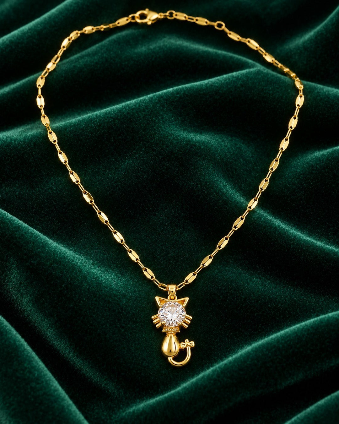 Elli Jewellery gold plated cat pendant necklace with a sparkling crystal center on a delicate chain
