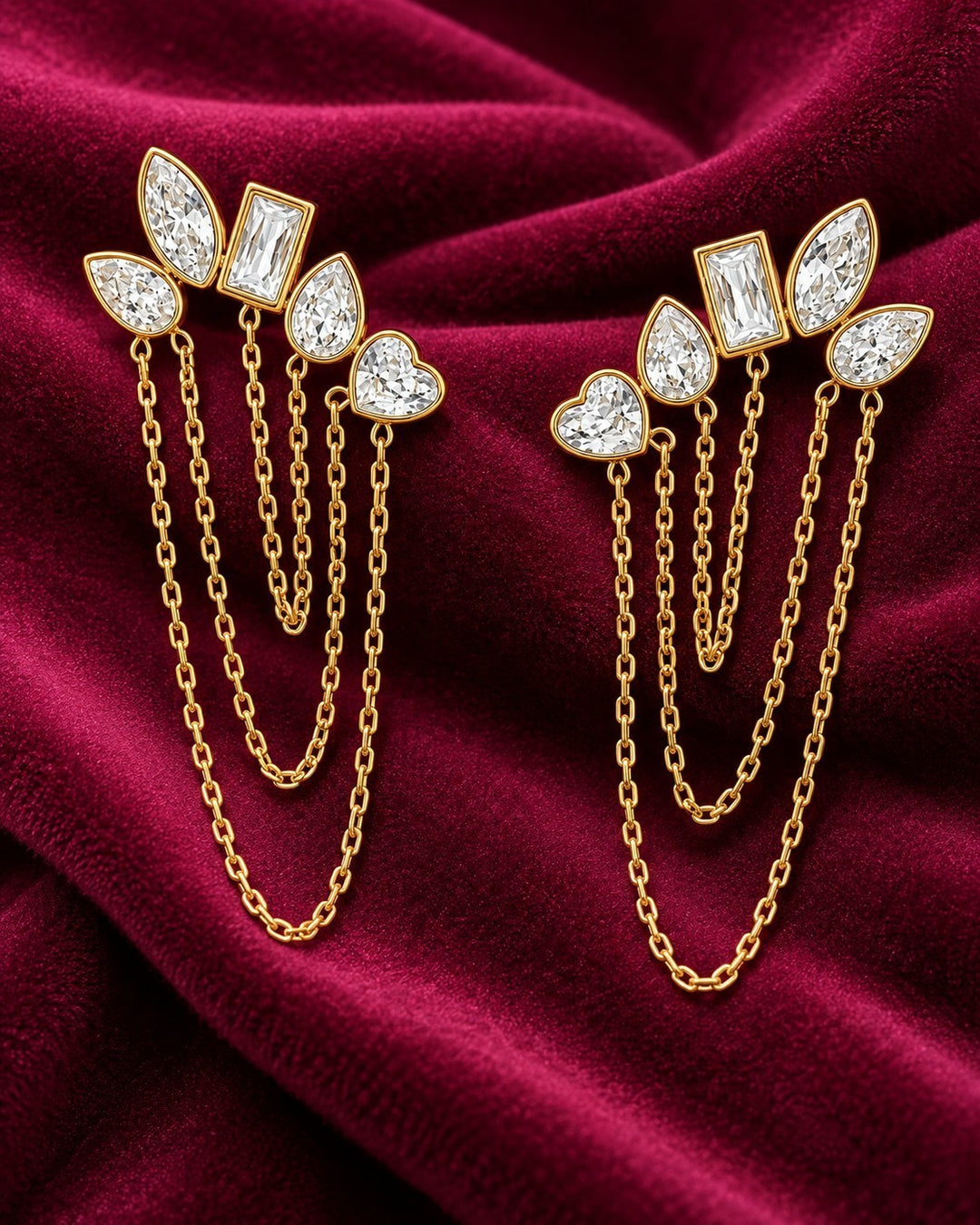 Elli Jewellery gold plated drop earrings featuring a cluster of mixed-cut crystals and delicate hanging chains.