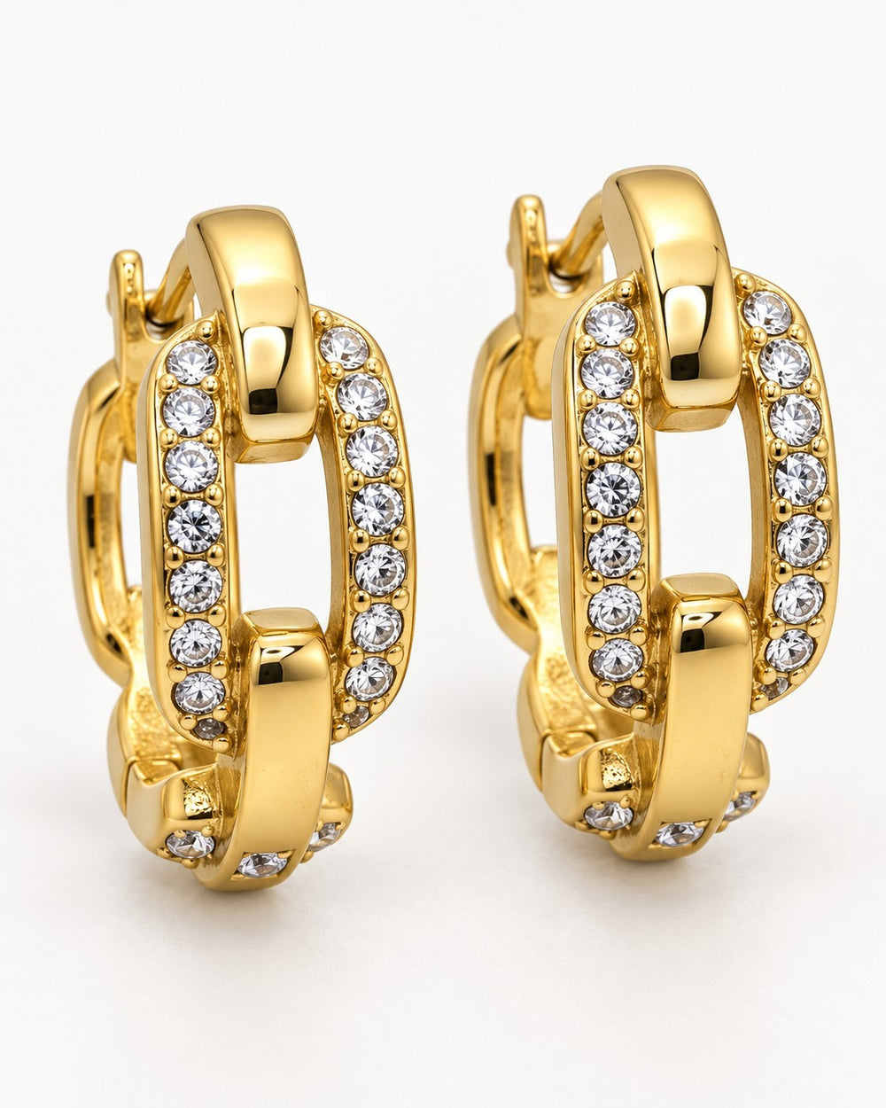 Elli Jewellery gold plated chunky chain link drop earrings with sparkling crystal accents on a white background