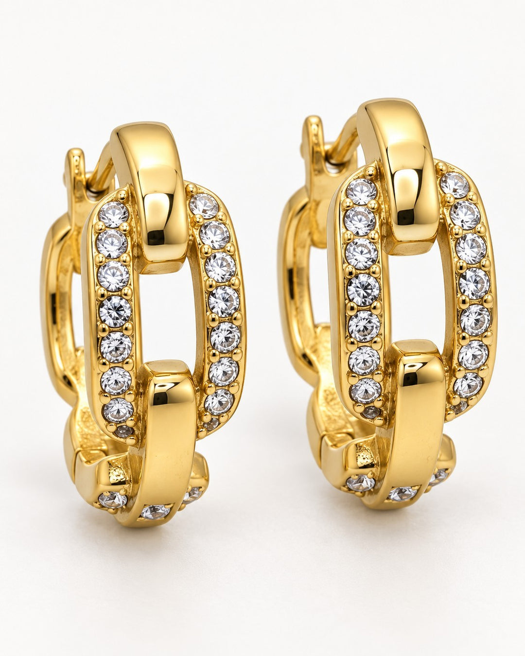 Elli Jewellery gold plated chunky chain link drop earrings with sparkling crystal accents on a white background