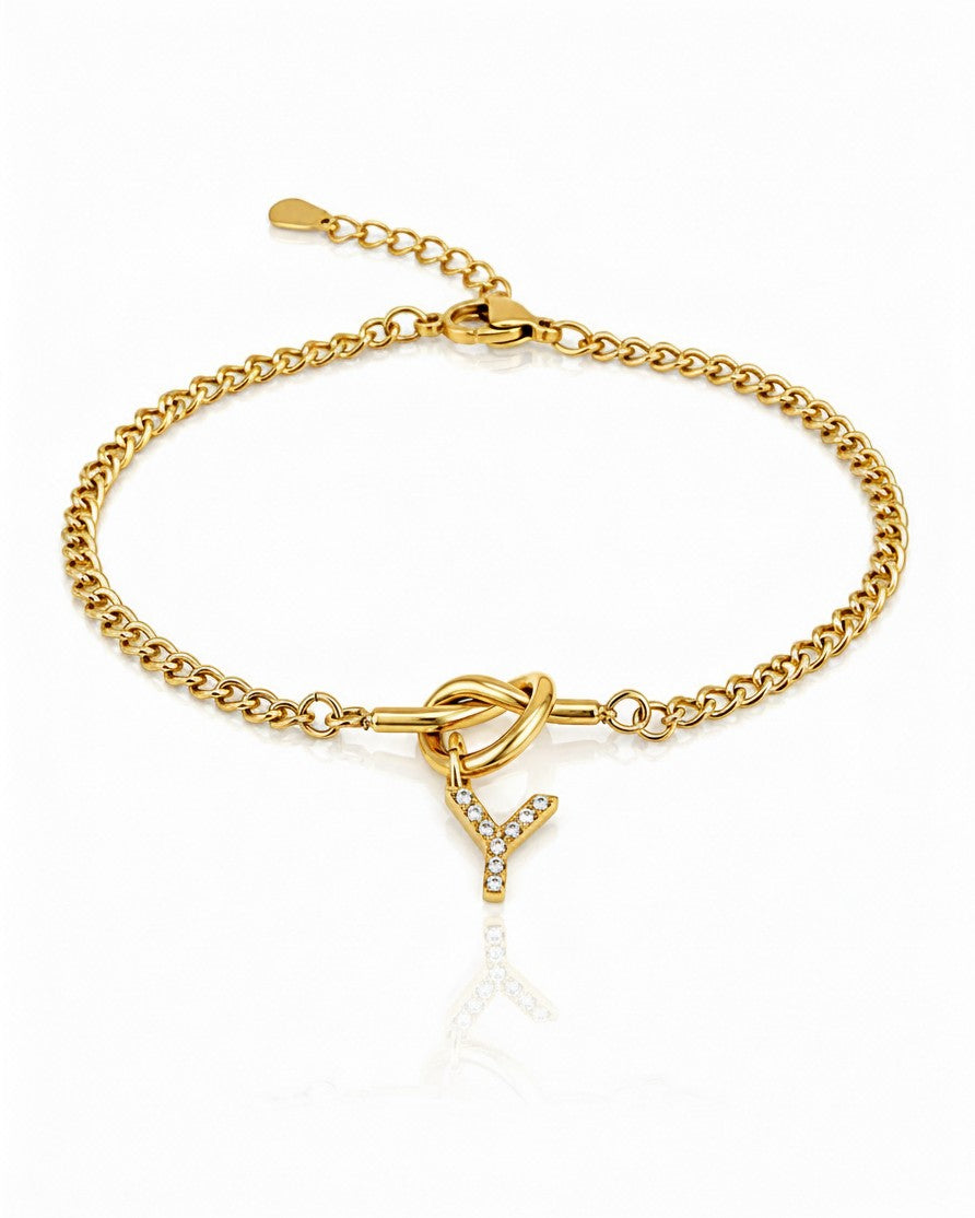Elli Jewellery gold plated chain bracelet featuring a sparkling crystal-encrusted letter Y charm and knot detail.