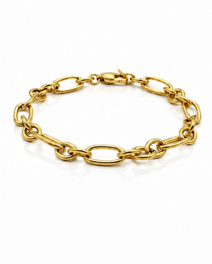 Elli Jewellery gold plated waterproof Cuban link chain bracelet with a chunky high-shine finish on a white background