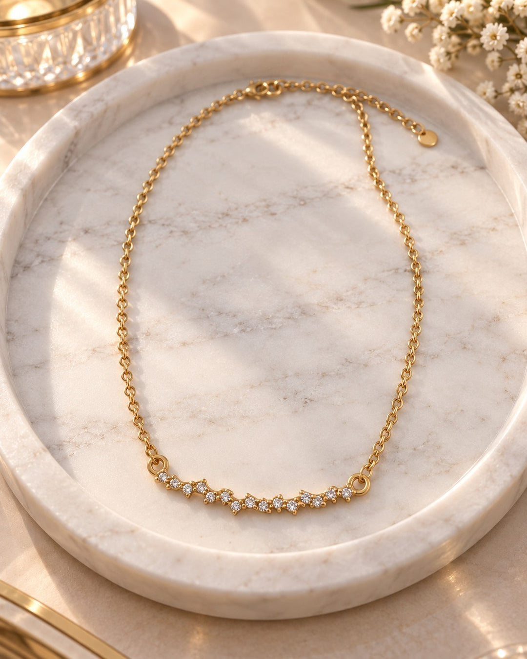 Elli Jewellery gold plated waterproof necklace featuring a delicate multi-stone cubic zirconia pendant on a chain.