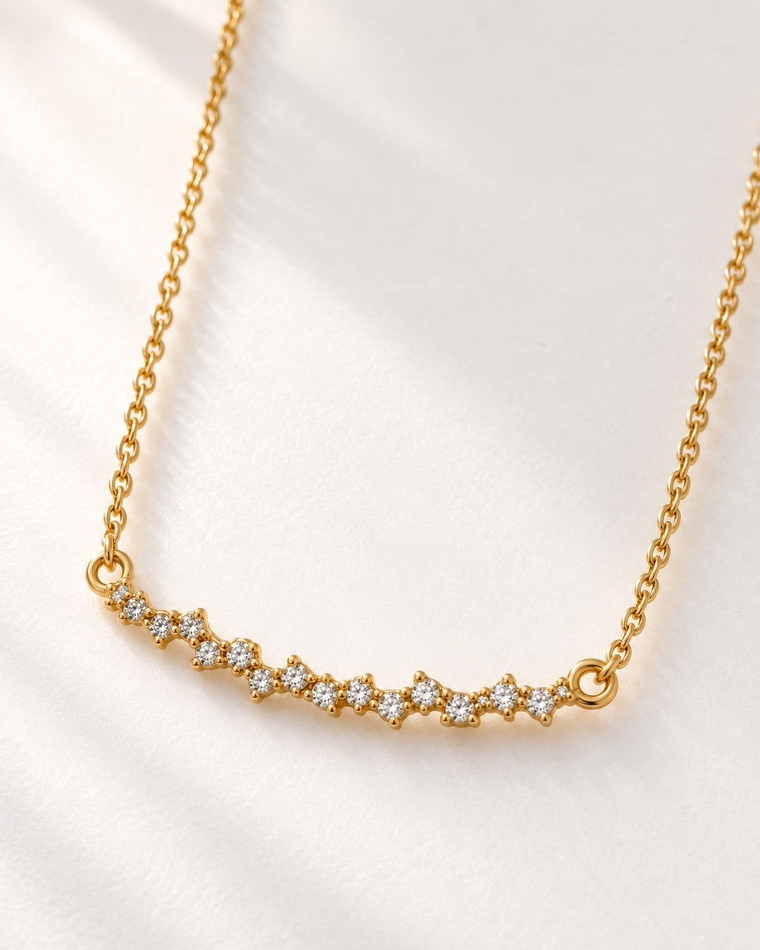 Elli Jewellery gold plated waterproof necklace featuring a delicate horizontal bar pendant with cubic zirconia stones.