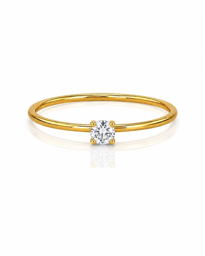 Elli Jewellery gold-toned ring featuring a single brilliant-cut cubic zirconia stone on a delicate band.