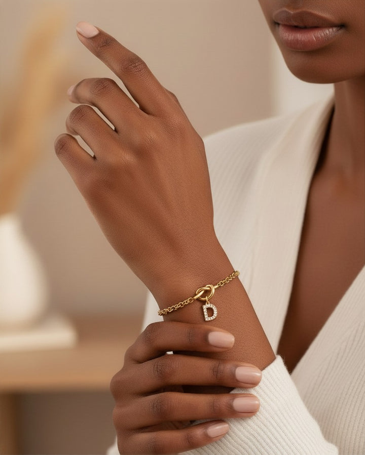 Elli Jewellery gold plated waterproof bracelet featuring a sparkling crystal diamante D initial charm on a delicate chain