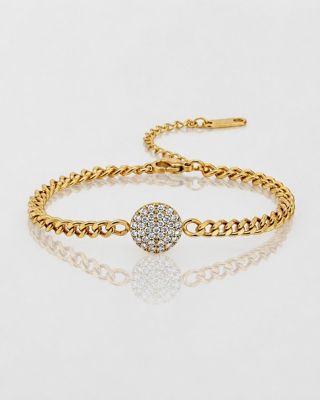 Elli Jewellery gold plated curb chain bracelet featuring a round diamanté encrusted pendant on a white background