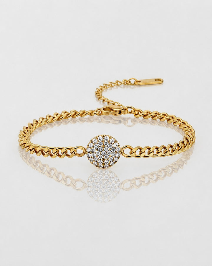 Elli Jewellery gold plated curb chain bracelet featuring a round diamanté encrusted pendant on a white background