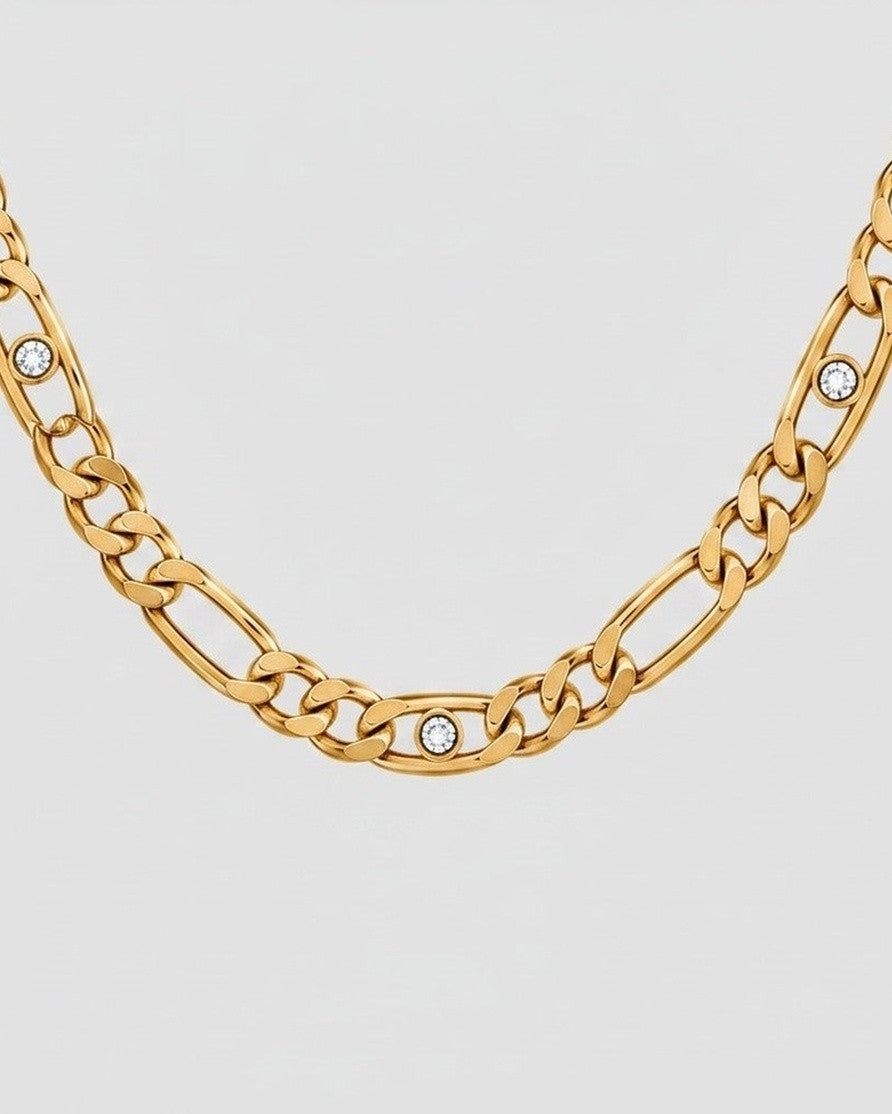 Elli Jewellery gold plated link chain necklace featuring embedded diamante crystals on a light grey background