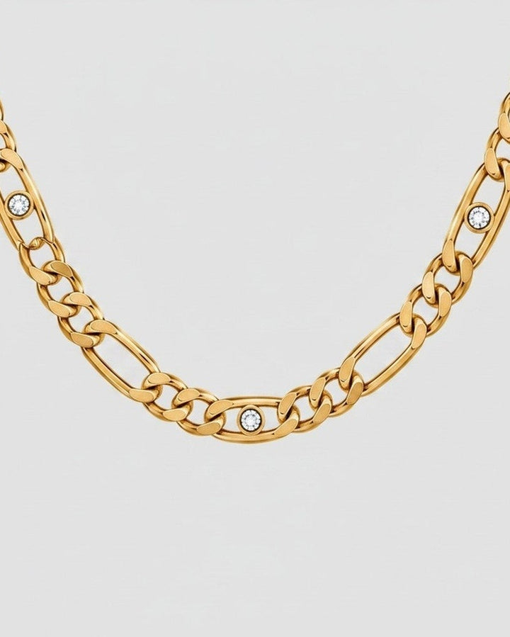Elli Jewellery gold plated link chain necklace featuring embedded diamante crystals on a light grey background