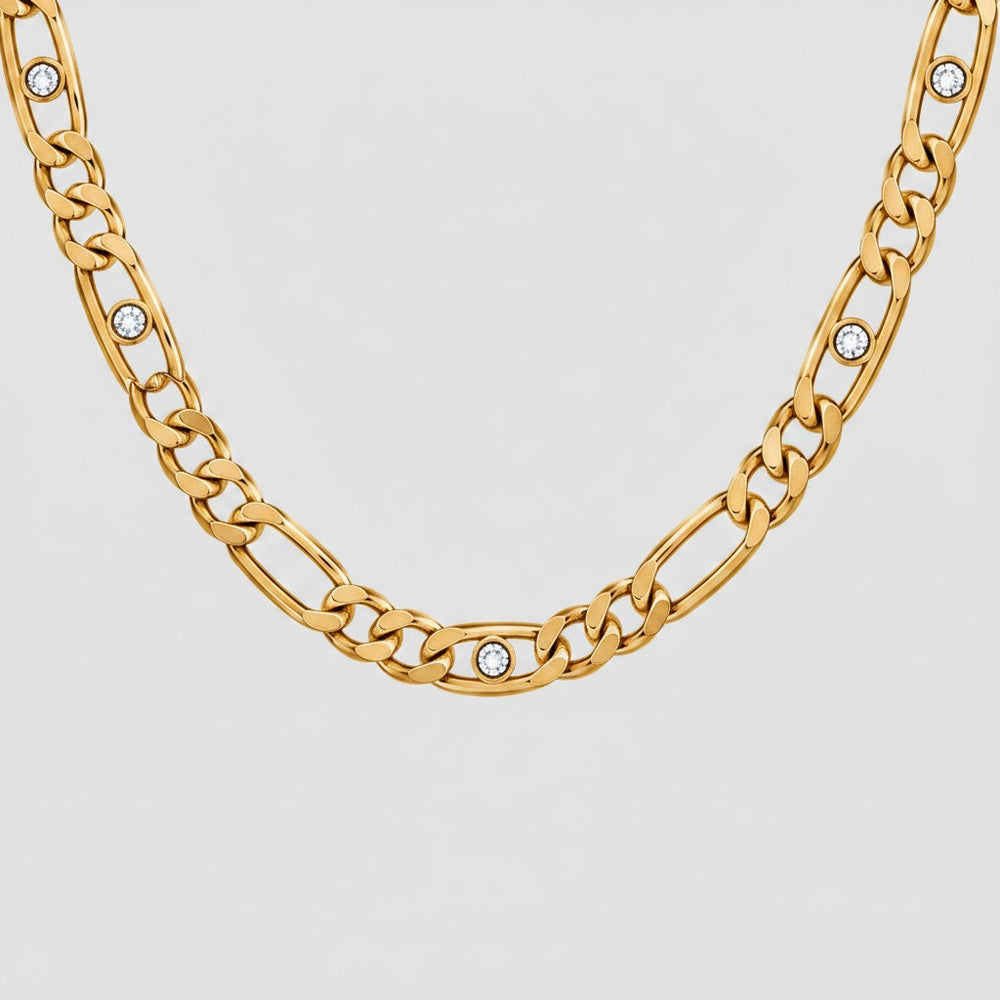 Elli Jewellery gold plated link chain necklace featuring sparkling diamante crystal accents on a light background.