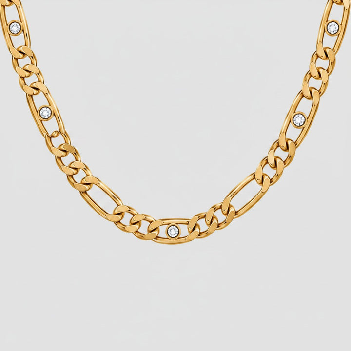 Elli Jewellery gold plated link chain necklace featuring sparkling diamante crystal accents on a light background.