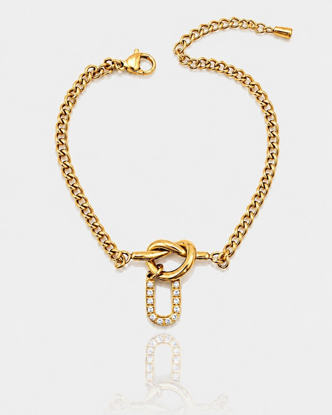 Elli Jewellery gold plated waterproof chain bracelet featuring a diamante U initial charm on a white background